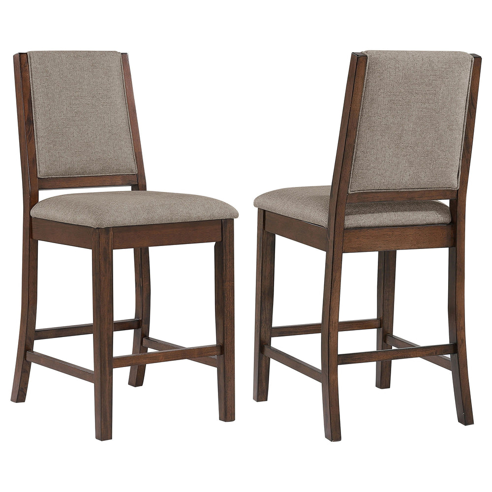 Choose casual farmhouse character for your kitchen or dining room with this set of two counter chairs. The pair features full backrests and built-in footrests, perfect for comfort in an inviting dining space. They show off a mango wood finish over sap wal