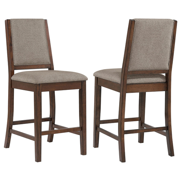 Choose casual farmhouse character for your kitchen or dining room with this set of two counter chairs. The pair features full backrests and built-in footrests, perfect for comfort in an inviting dining space. They show off a mango wood finish over sap wal