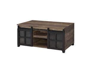 The rustic wooden frame and industrial metal accent complement each other perfectly. The coffee table embodies a raw, utilitarian aesthetic that adds a strong design presence to the space. Two sliding barn doors with obscure glass insert offer both privac