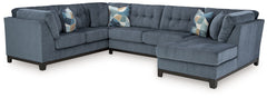 Fresh, on-trend style meets functionality in this sectional with chaise. Details like tufted cushions and a wrap-around accent base reflect your urban contemporary tastes while staying versatile as your style changes. And with its soft upholstery, your co