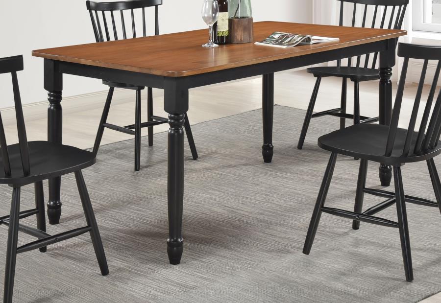 Enjoy gatherings for meals and conversation at this traditional dining table. A charming addition for a welcoming space, it features a compact rectangular profile perfect for four or six, with a distinctive two-tone look that catches the eye. The table fe