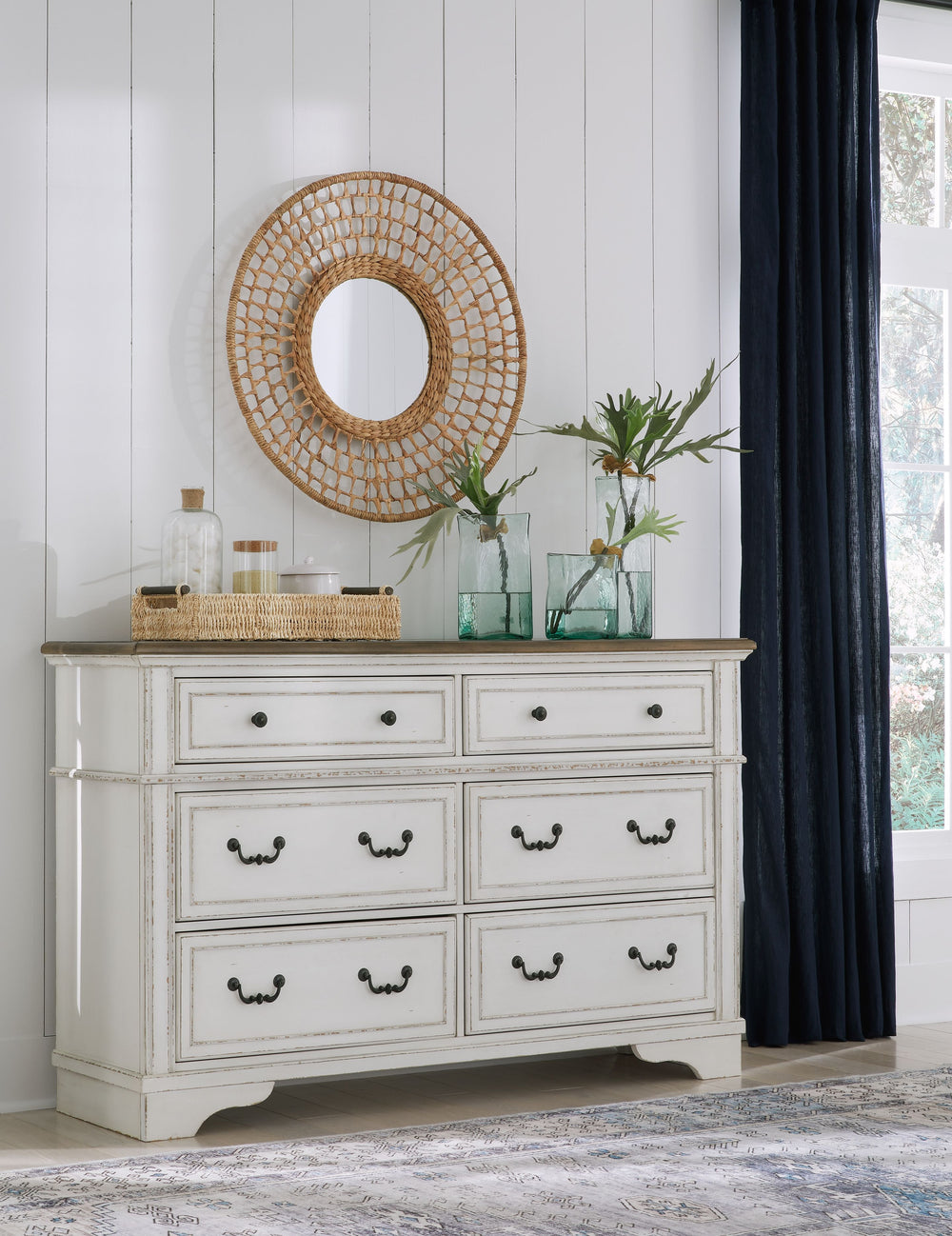 Traditional design. Casual appeal. You can have it all with this dresser. A relaxed two-tone aesthetic merges with ornate profiled drawer fronts and pilasters to give the distinctive piece an allure all its own. Expansive drawers with quality dovetail con
