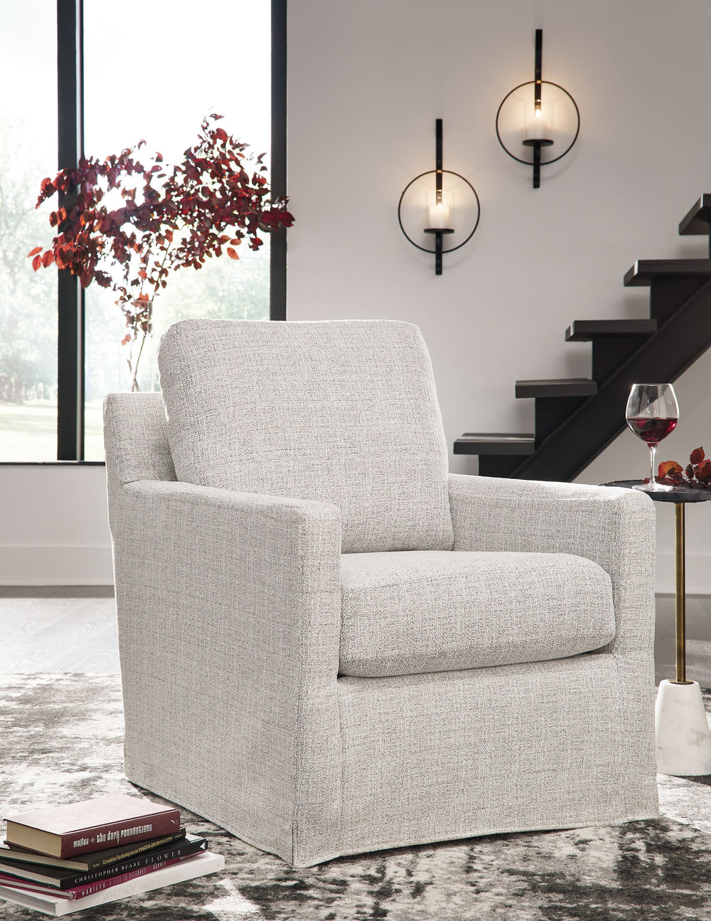 This swivel glider accent chair makes everyday lounging refreshingly low-maintenance. Handle spills with ease thanks to washable performance fabric. This chair delivers form and function all in one, keeping messes manageable so you donâ€™t have to.<br><br