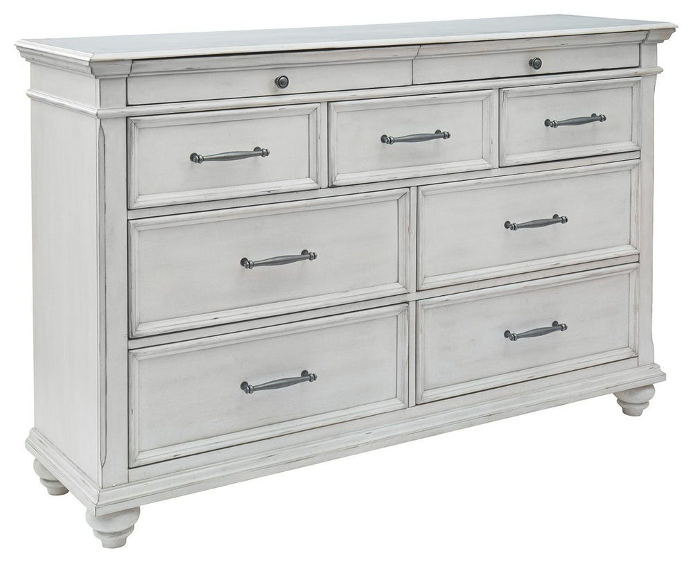 Give your retreat vintage charm and valuable drawer storage with this dresser. In a beautifully distressed whitewash finish, you-'ll love putting it all away in casual style. Seven full-sized drawers and two accessory top drawers will easily accommodate y