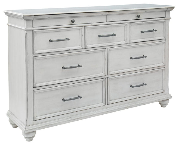 Give your retreat vintage charm and valuable drawer storage with this dresser. In a beautifully distressed whitewash finish, you-'ll love putting it all away in casual style. Seven full-sized drawers and two accessory top drawers will easily accommodate y