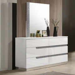 The Paradox 2 Piece Dresser and Mirror set in White exudes modern sophistication and quality. Featuring a dresser and a mirror, this set is designed to enhance any bedroom with its contemporary appeal. The gleaming white gloss laminate finish offers a sle
