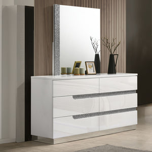 The Paradox 2 Piece Dresser and Mirror set in White exudes modern sophistication and quality. Featuring a dresser and a mirror, this set is designed to enhance any bedroom with its contemporary appeal. The gleaming white gloss laminate finish offers a sle