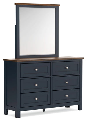 Add homespun charm to your restful retreat. A modern take on a timeless silhouette, this dresser and mirror set pairs a dark slate blue finish with a light brown top. Drawer fronts and legs in a classic Shaker style bring an air of beautiful simplicity to