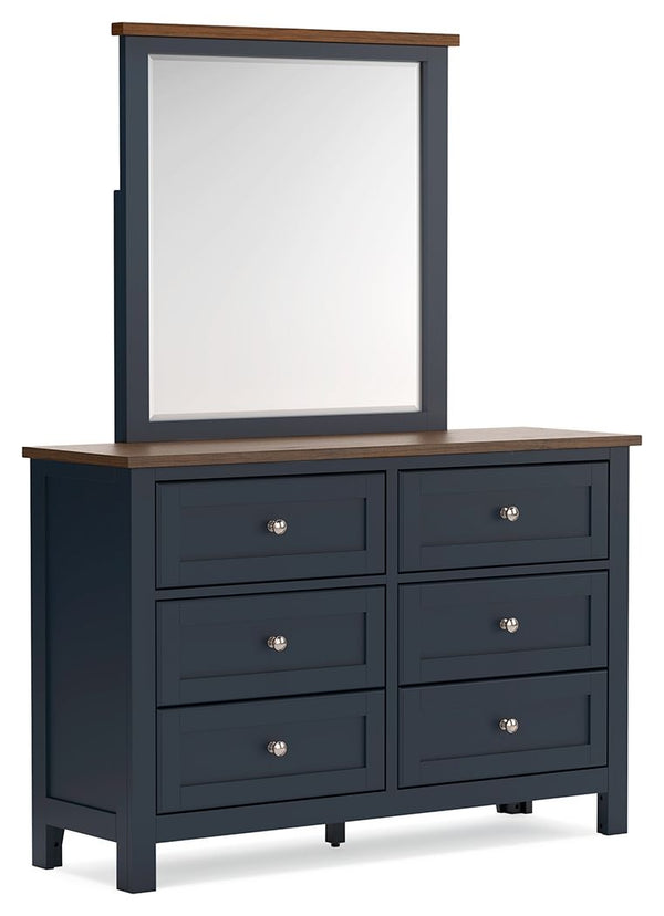 Add homespun charm to your restful retreat. A modern take on a timeless silhouette, this dresser and mirror set pairs a dark slate blue finish with a light brown top. Drawer fronts and legs in a classic Shaker style bring an air of beautiful simplicity to