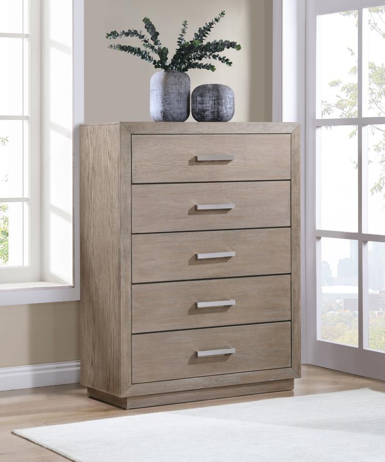 Chrome finish bar pulls add a touch of shine to the neutral barley brown finish of a modern five-drawer chest. Delivering ample storage with a compact footprint, the chest features a streamlined silhouette with mitered trim that creates a sense of depth. 