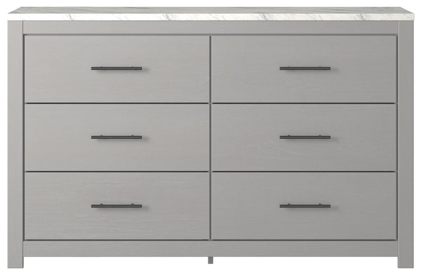  clean and casually modern. This dresserâ€™s wispy dove gray finish and faux Calcutta marble top set the tone for your calming sanctuary. Large linear pulls add dimension and authenticity. Six smooth-gliding drawers neatly accommodate your wardrobe n