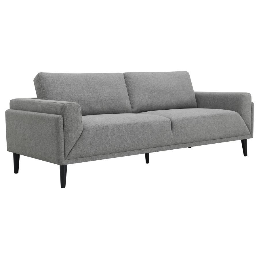 Unveiling our modern sofa, where innovation meets elegance in a frame within a frame design. Adorned in a chic fabric, its streamlined silhouette is highlighted by meticulous topstitch details and track arms complemented by mitered front accents. Prioriti