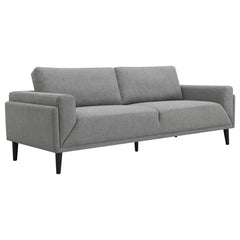 Unveiling our modern sofa, where innovation meets elegance in a frame within a frame design. Adorned in a chic fabric, its streamlined silhouette is highlighted by meticulous topstitch details and track arms complemented by mitered front accents. Prioriti