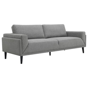 Unveiling our modern sofa, where innovation meets elegance in a frame within a frame design. Adorned in a chic fabric, its streamlined silhouette is highlighted by meticulous topstitch details and track arms complemented by mitered front accents. Prioriti