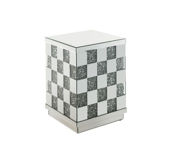 Bring life into your home with this dazzling Noralie End Table. With glamorous mirror finish and faux diamond inlay, the stunning end table will impress all of your guests. The faux diamonds reflect a rainbow of colors throughout the room. The mirrored po