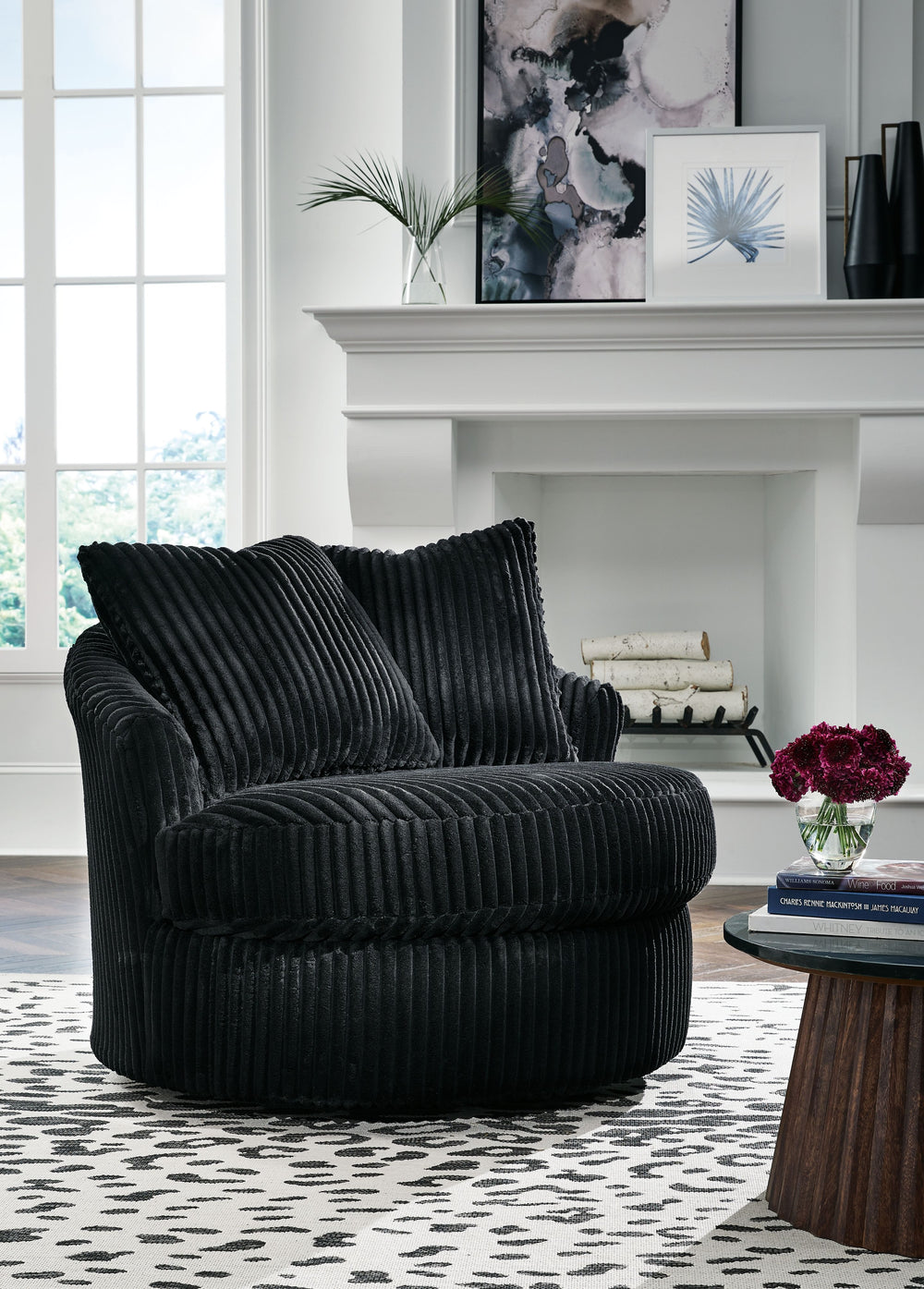 This swivel chair takes style and comfort full circle. Its plush, neutral corduroy upholstery is casually cool and beautifully on trend, while throw pillows elevate the cozy factor. A smooth-gliding 360-degree swivel lets you go with the flow. Come on, yo