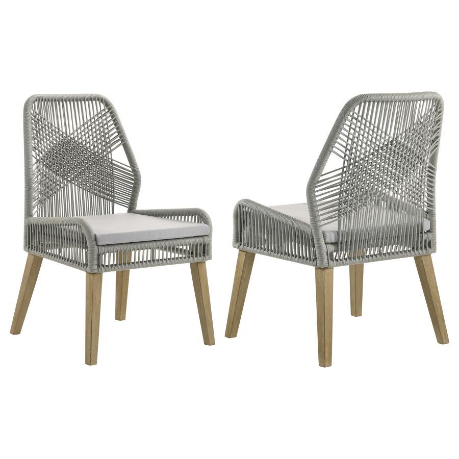 Capture the exotic flavor of this fun dining chair. Perfect for everyday use in a dressed up casual space, its sleek grey woven seat and seat back reflects an artful, inspirational design. Weathered wash finish wood legs taper slightly and slant just enou