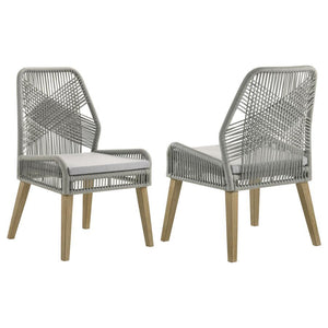 Capture the exotic flavor of this fun dining chair. Perfect for everyday use in a dressed up casual space, its sleek grey woven seat and seat back reflects an artful, inspirational design. Weathered wash finish wood legs taper slightly and slant just enou