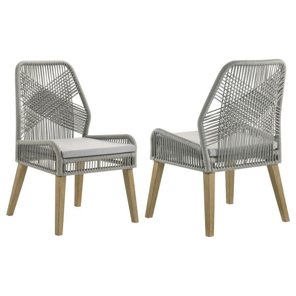 Capture the exotic flavor of this fun dining chair. Perfect for everyday use in a dressed up casual space, its sleek grey woven seat and seat back reflects an artful, inspirational design. Weathered wash finish wood legs taper slightly and slant just enou