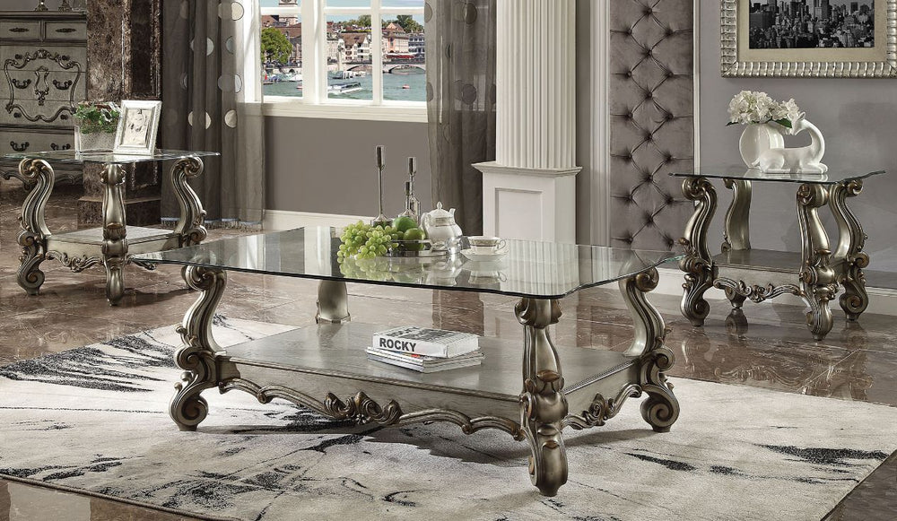 KD, Rectangular Coffee Table w/Glass Top â€¢ Open Compartment: Bottom Shelf â€¢ 10mm Clear Tempered Glass w/Beveled â€¢ Oversized Scrolled Legs & Shelf Apron: Poly Resin with Antique Contrast Finish<br/><br/><b>Product Features</b><ul><li>Exclusive Design