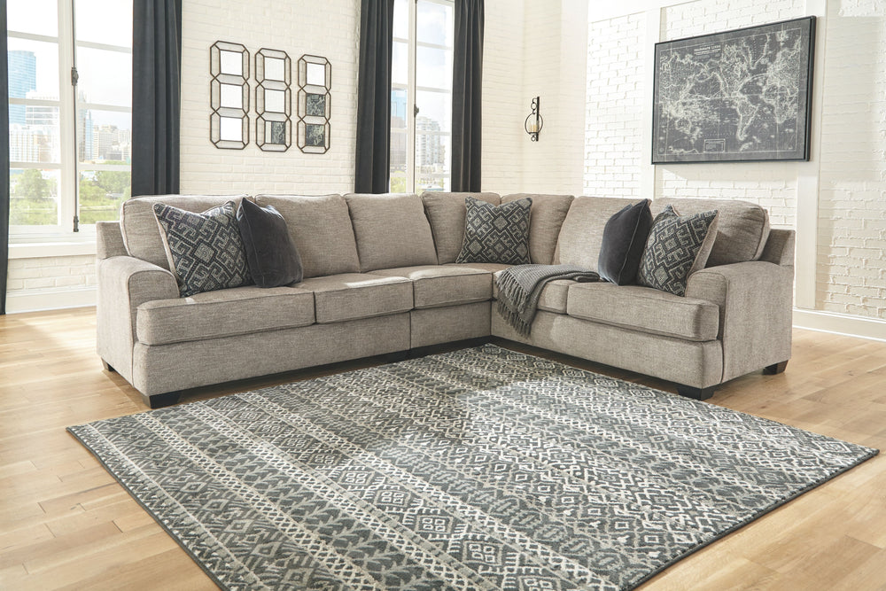 Whether your vision is clean and contemporary or cozy modern farmhouse, this sectional in a stone-tone neutral upholstery has the corner on style. Merging ultimate comfort with striking good looks, this chic sectional includes five coordinating accent pil