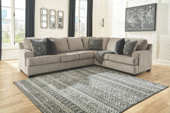 Whether your vision is clean and contemporary or cozy modern farmhouse, this sectional in a stone-tone neutral upholstery has the corner on style. Merging ultimate comfort with striking good looks, this chic sectional includes five coordinating accent pil