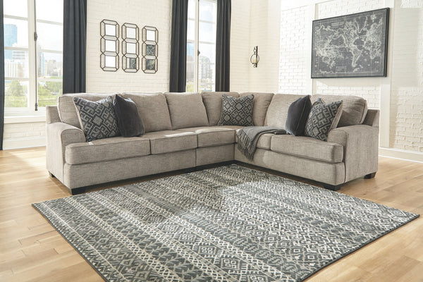 Whether your vision is clean and contemporary or cozy modern farmhouse, this sectional in a stone-tone neutral upholstery has the corner on style. Merging ultimate comfort with striking good looks, this chic sectional includes five coordinating accent pil