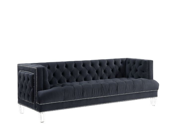 Sophistication meets modern with the Ansario living room collection. The rich blue velvet adds character to any room. Showcasing a square back, high arms, and nail-head trim, feature button tufted accents. The acrylic legs give off a modern vibe to the pi