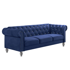 The New Classic Emma Chesterfield Velvet 3 Seat Sofa is a blend of soft elegance and sophisticated design. Crafted from 100% polyester velvet fabric, it offers cozy and indulgent seating for three. The glam tailoring features tufted backs and arms adorned