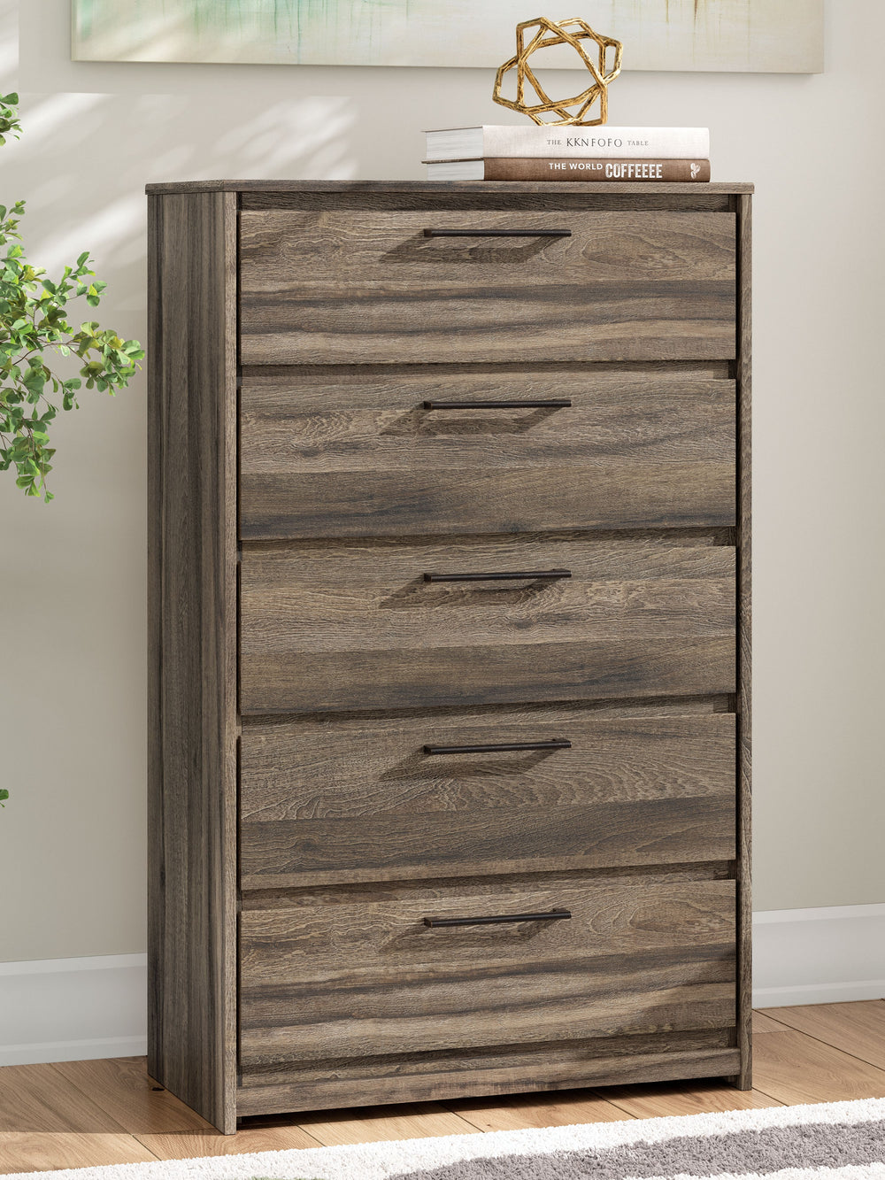 Casually cool style and lots of storage go hand in hand with this chest of drawers. A weathered brown finish over replicated oak grain creates an easygoing vibe, setting the scene in your restful retreat. Clean lines and modern handles provide a fuss-free