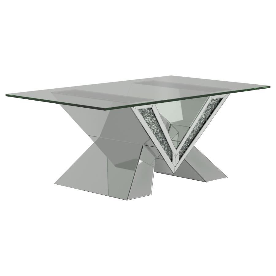 This mirrored coffee table serves as a stunning centerpiece with its bold design. The V-shaped base showcases mirrored panels and sparkling crystal accents for an opulent look. The rectangular, beveled tempered glass top adds elegance and practicality, ma