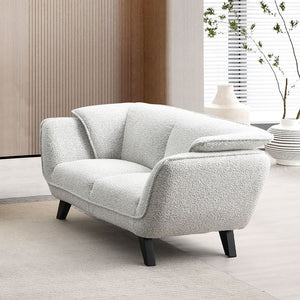 Unwind in the sophisticated charm of the Manon sofa, draped in light gray fabric. Accompanied by plush pillows, it offers a perfect blend of comfort and style. This sofa invites cozy conversations and serene relaxation, making it an ideal addition to any 
