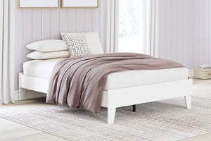  the low-profile bed frame fits right in with your minimalist 