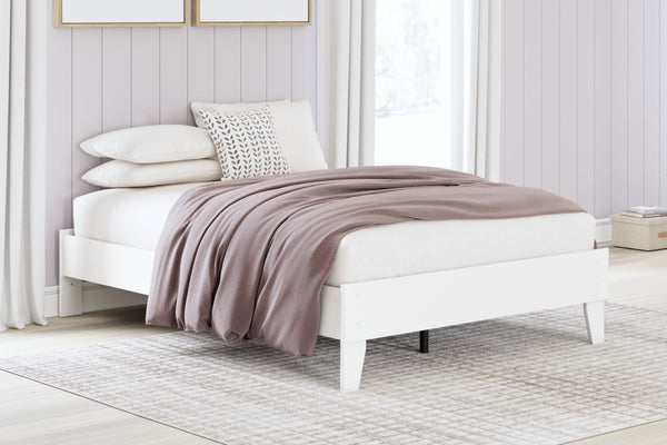  the low-profile bed frame fits right in with your minimalist 