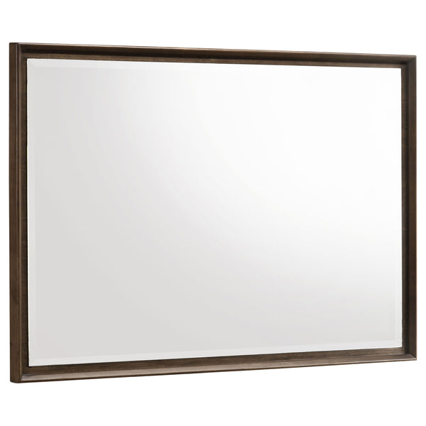 Augment your stylish dresser with a modern framed mirror. Perfect for the dresser top, it mounts directly and features a warm brown wood finish. The mirror boasts beveled glass for added depth, complementing its stylish reflectivity and depth. Mitered tri
