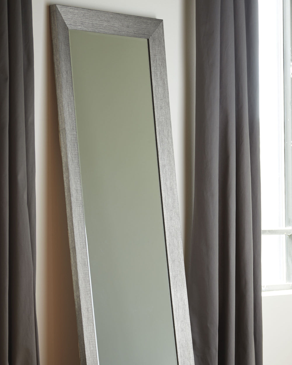 With simple lines and a sleek finish, this floor mirror reflects the very best of contemporary design. Floor-length style is ideal for a dressing room or at the end of a hallway.<br><br><b>Additional Dimensions</b><br><ul><li>Inner mirror: 0-"</li></ul><b