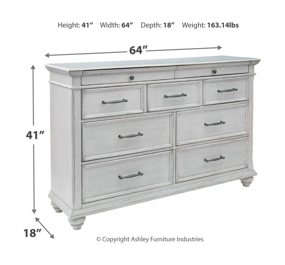 Made with veneers and select hardwood solids in a distressed whitewashed finish. Design features updated traditional styling with generously scaled moulding details. Dresser features 7 full sized drawers with 2 small scaled accessory drawers. Ball bearing