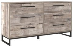 Part beach chic, part urban hip, this dresser is everything you dreamed of, at a comfortably cool price. The butcher block whitewash finish over replicated pine grain lends a richly relaxed aesthetic that suits your sensibility. Dark pewter-tone drawer pu