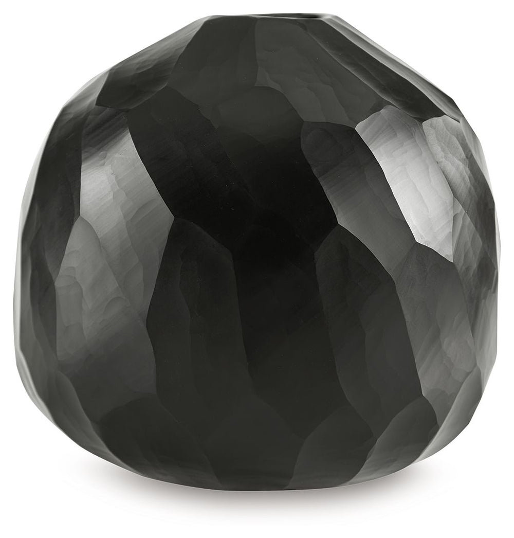 Put the accent on contemporary style with this vase. Wowing with multiple hand-carved facets, the cool black glass delivers true textural appeal from every angle. Itâ€™ll bring an artful touch wherever you see fit.<br/><br/><b>Product Features</b><ul><li>
