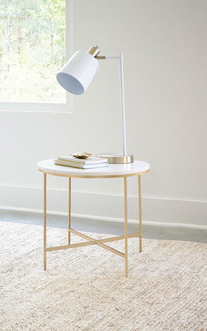  offering a sleek and modern design for any living space. The sturdy structure features a welded iron frame with a luxurious gold finish