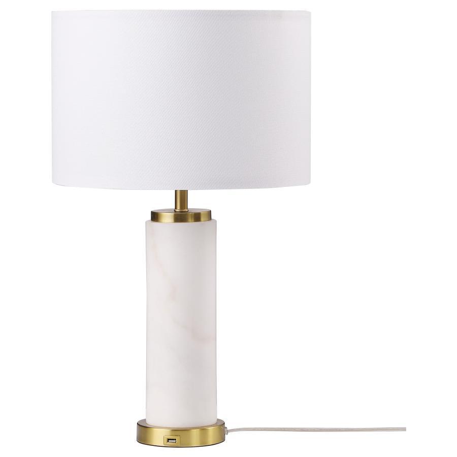 Classic luxury meets modern in a charming table lamp built for a sophisticated living space. A white marble column centers the lamp, offering luxe energy and appeal in any setting, from a nightstand to a server and beyond. Soft gold accents enhance the la