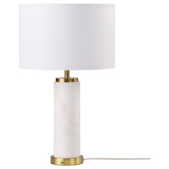 Classic luxury meets modern in a charming table lamp built for a sophisticated living space. A white marble column centers the lamp, offering luxe energy and appeal in any setting, from a nightstand to a server and beyond. Soft gold accents enhance the la