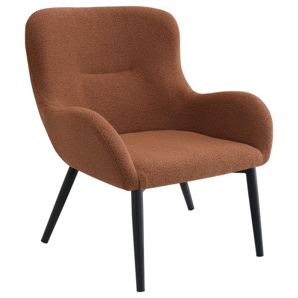 Add a touch of color to your living room seating ensemble with a modern accent armchair. Its inviting silhouette boasts prominent curves, with a rounded back and flared arms. A single line of tufting adds dimensionality to the look, while plush foam cushi