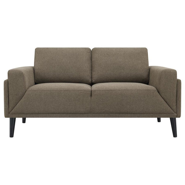  its streamlined silhouette is highlighted by meticulous topstitch details and track arms complemented by mitered front accents. Prio