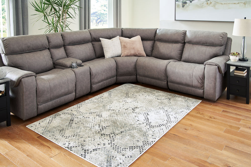 With its cool take on snakeskin, this area rug has us floored with an ultra-contemporary sense of style. Richly understated, the muted palette keeps the look chic and upscale.<br/><br/><b>Product Features</b><ul><li>Made of heat set polypropylene/polyeste
