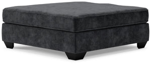 Make room for big-time comfort and style with this oversized accent ottoman. Designed to multitask as a footrest and casually cool coffee table, the firmly cushioned square ottoman is covered in a decadently soft, plush microfiber thatâ€™s love at first t
