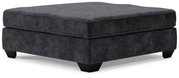 Make room for big-time comfort and style with this oversized accent ottoman. Designed to multitask as a footrest and casually cool coffee table, the firmly cushioned square ottoman is covered in a decadently soft, plush microfiber thatâ€™s love at first t