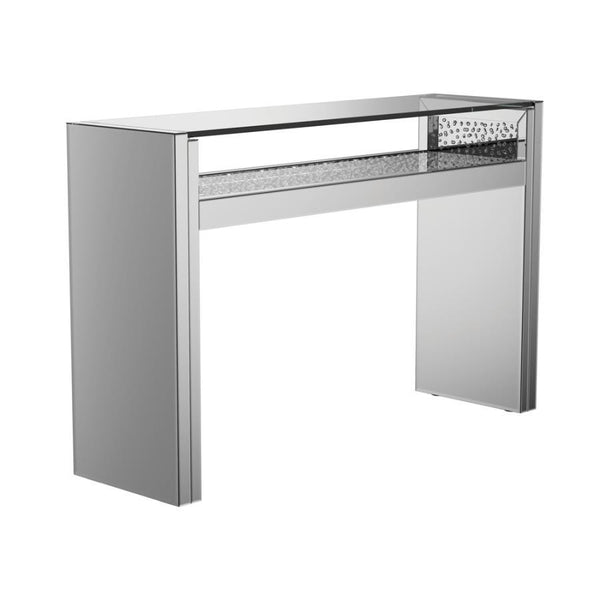 Add instant glamour with this LED console table featuring mirrored panels, a floating tempered glass top, and shimmering faux crystals. The clean, geometric silhouette offers a contemporary touch, while the silver finish brightens any room. Perfect for en