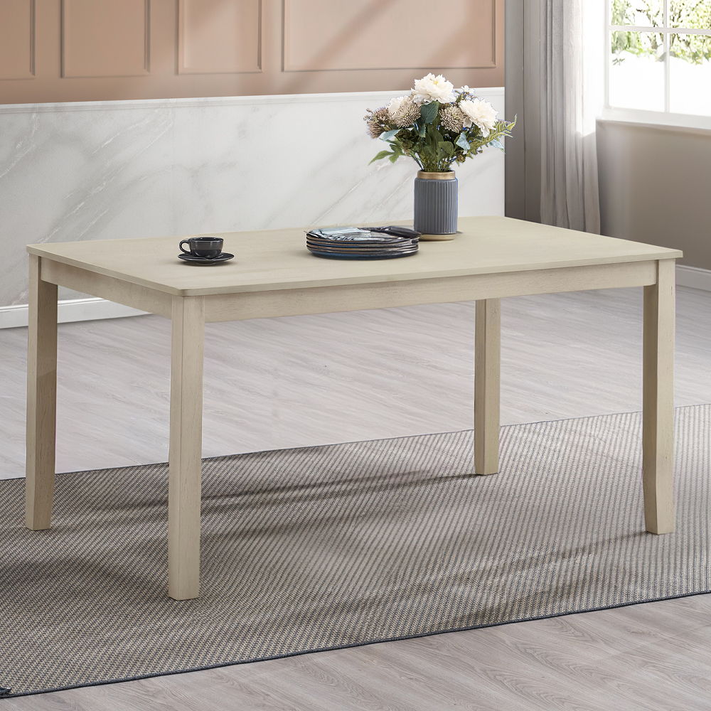 Ferris dining table boasts an antique gray finish exuding timeless elegance. The set includes chairs with intricately designed backs and padded seat cushions, ensuring comfort and style for your dining experience. Perfect for both casual meals and formal 