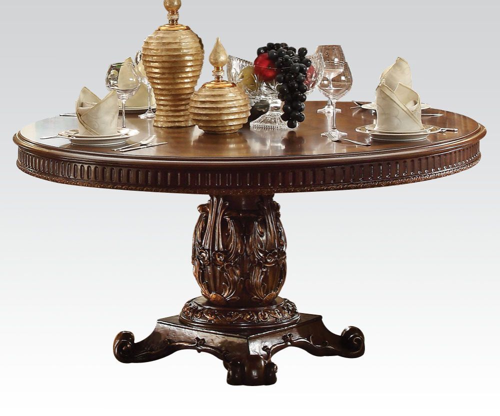 The Vendome traditional dining collection features a pedestal dining table complemented with oversized upholstered chairs all accented by floral carving decorative base and feet. Matching curio reflects all carefully selected design features as the dining